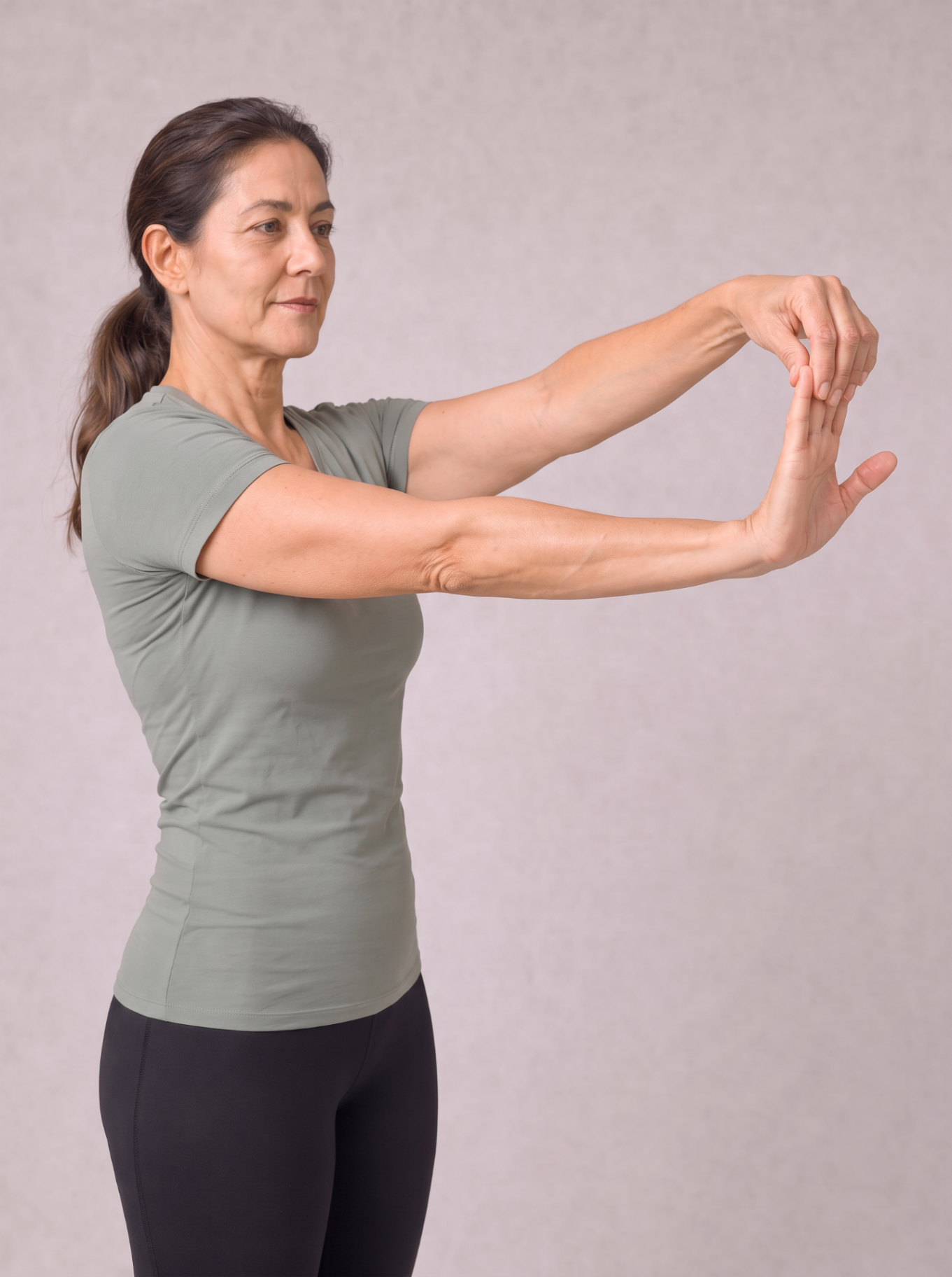 Standing forearm flexor stretch with the fingers drawn back