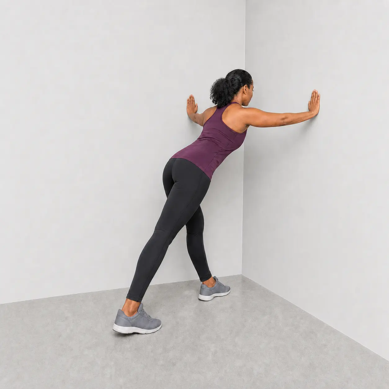 Corner stretch with hands higher on the walls