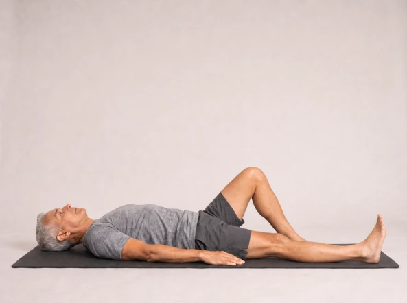 Straight leg raise starting position with one knee bent and the exercise leg straight on the mat