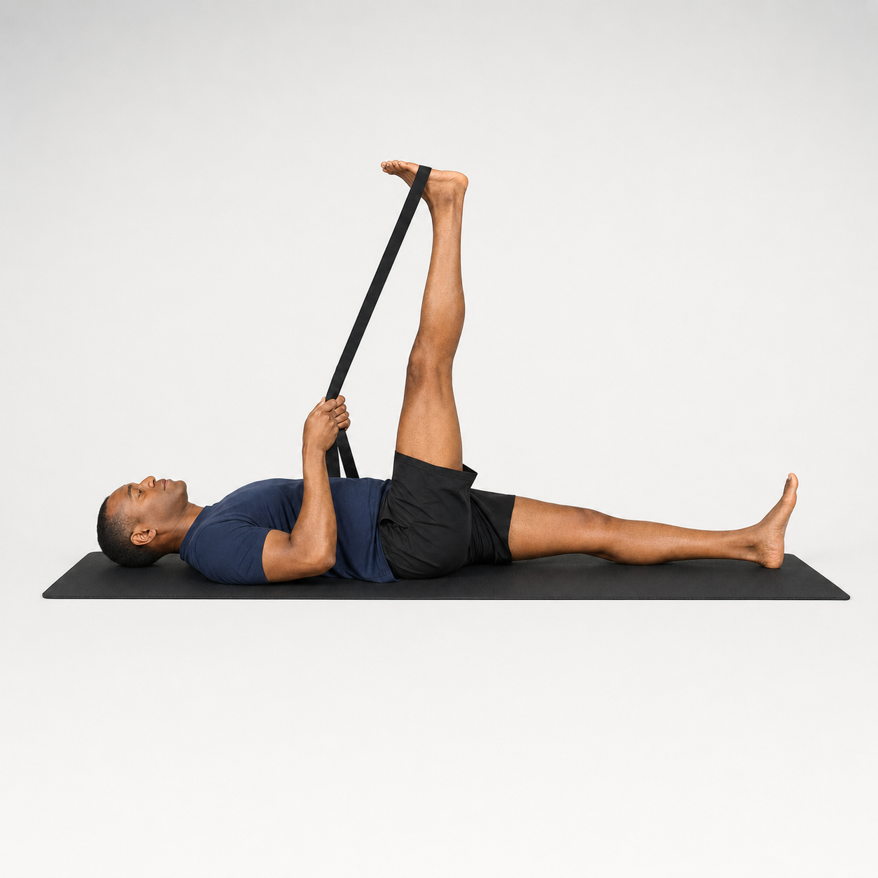Supine hamstring stretch using a strap around the foot