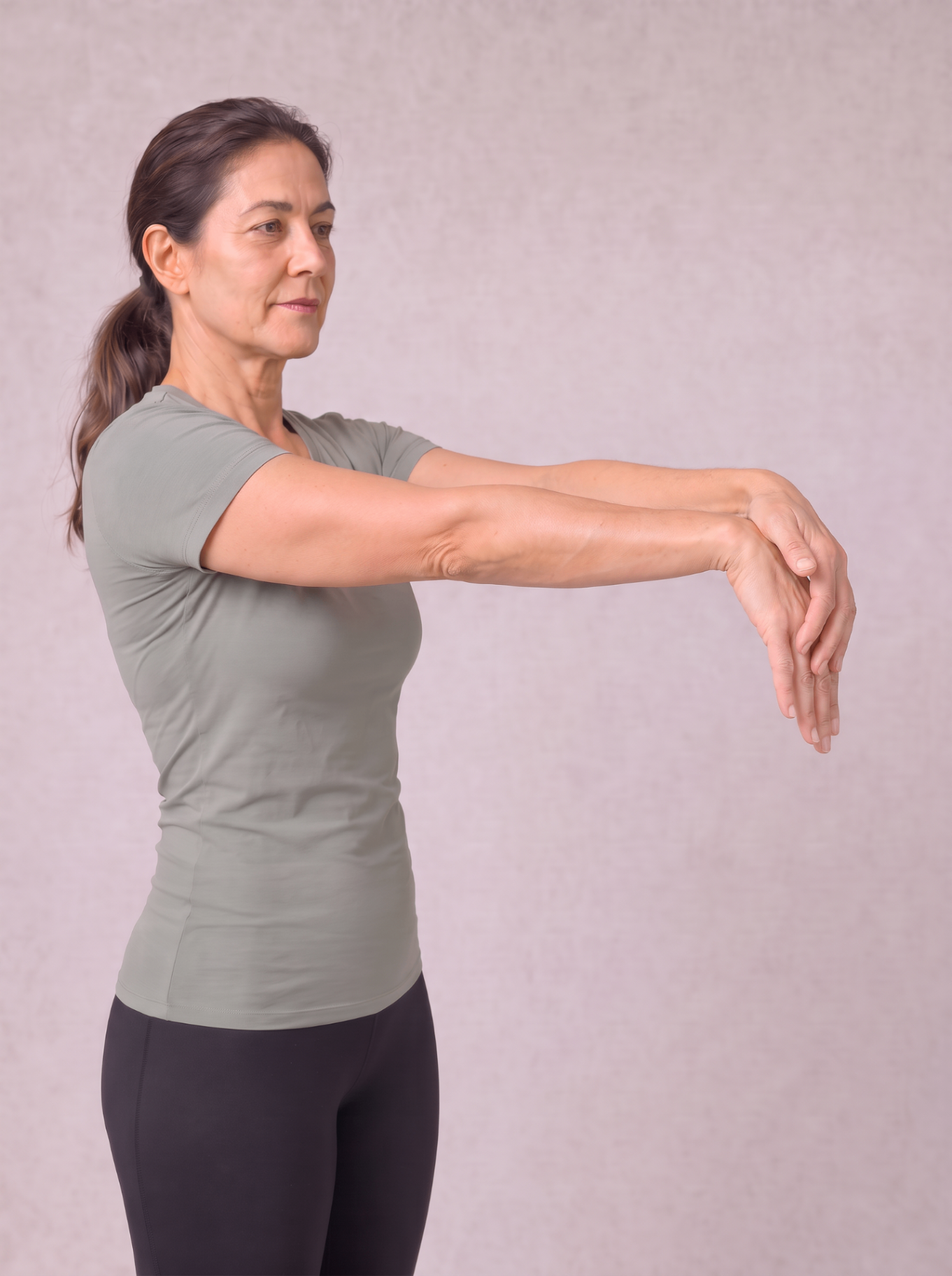 Standing forearm extensor stretch with the wrist bent downward